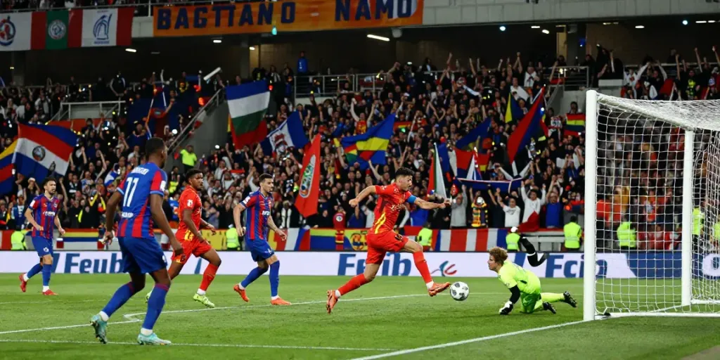 TOP10 นักเตะ showcasing an intense football moment with a striker shooting towards the goal amidst defenders.